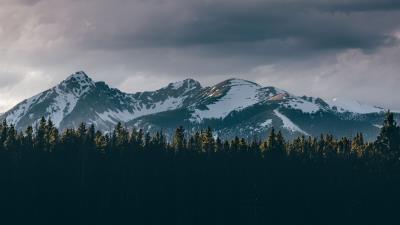 Mountains trees tops snow sky 4k wallpaper