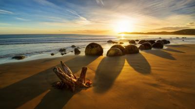 New zealand ocean sunrise rocks coastlin 4k wallpaper