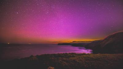 Night starry sky stars sea shore 4k wallpaper