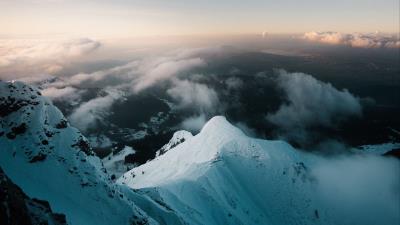 Peak snow clouds 4k wallpaper