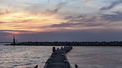 Pier sea stones horizon 4k wallpaper