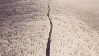 Road aerial view winter 4k wallpaper