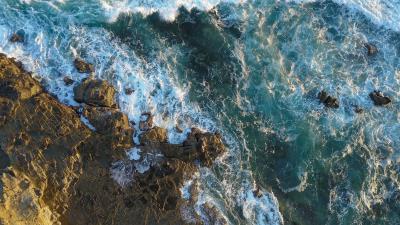 Rocks aerial view sea 4k wallpaper