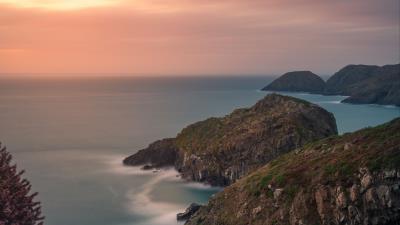 Rocks coast sea gg 4k wallpaper