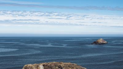 Rocks ocean skyline 4k wallpaper