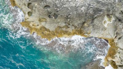 Rocks sea aerial view 4k wallpaper