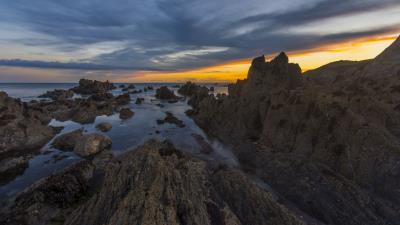 Rocks sea sunset h 4k wallpaper