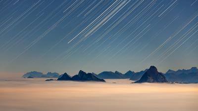 Rocks starfall fog 4k wallpaper