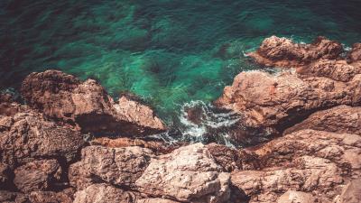 Rocks water aerial view 4k wallpaper