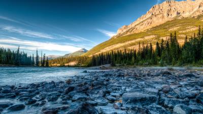 Rocky mountains river stones 4k wallpaper
