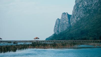 Sea mountains bridge rocks 4k wallpaper