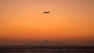 Sea sky plane 4k wallpaper