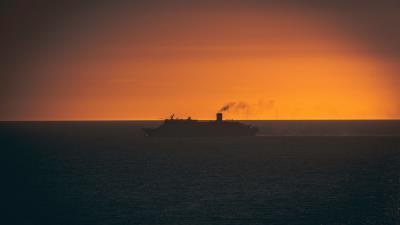 Ship swimming sunset horizon 4k wallpaper