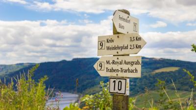 Signs germany pole directions mountains 4k wallpaper