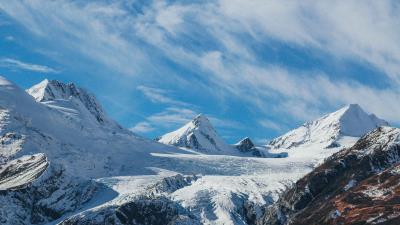 Snowy mountains top sky clouds 4k wallpaper