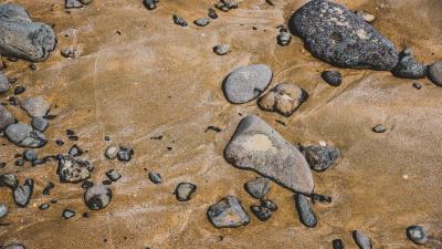 Stones pebbles sand 4k wallpaper