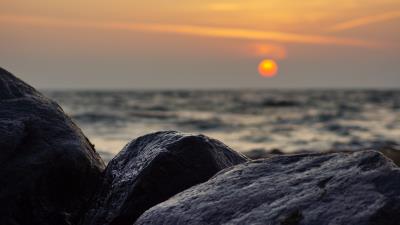 Sunset rocks stones 4k wallpaper