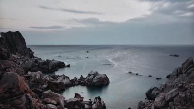 Sunset sea rocks sky 4k wallpaper