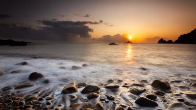 Sunset stones pebbles 4k wallpaper