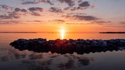 Sunset stones sea 4k wallpaper