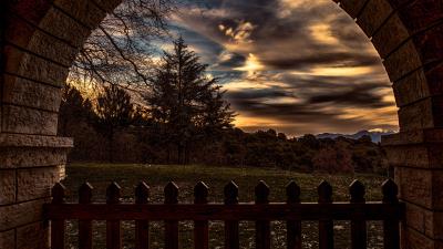 Sunset trees fence arch 4k wallpaper