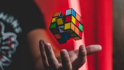 Rubiks cube hand toss 4k wallpaper