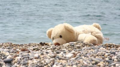 Soft toy bear beach rocks se 4k wallpaper