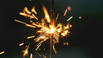 Sparkler sparks hand 4k wallpaper
