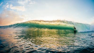 Surfer surfing wave 4k wallpaper