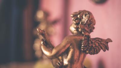 Angel gold wings figurine 4k wallpaper