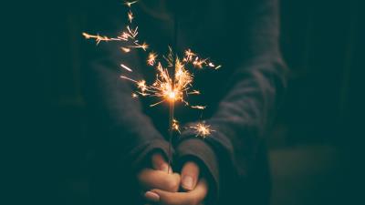 Bengal fire sparks hands 4k wallpaper