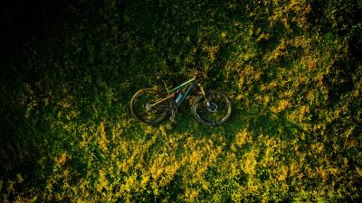 Bike grass aerial view 4k wallpaper