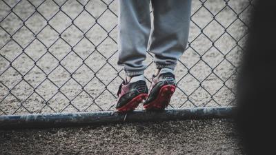 Boots feet child football fence grid 4k wallpaper