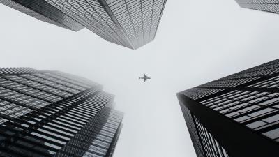 Buildings plane sky image 4k wallpaper