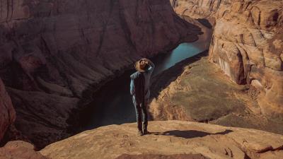 Canyon man cliff 4k wallpaper