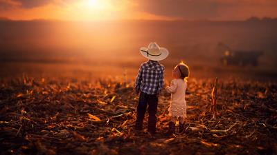 Children sunset grass 4k wallpaper
