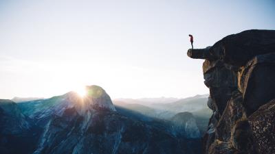 Cliff rock man 4k wallpaper