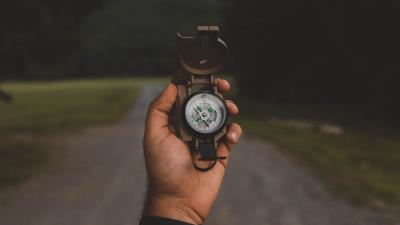 Compass hand nature 4k wallpaper