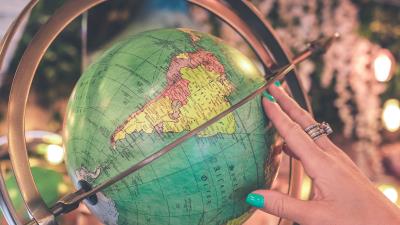 Globe hand map 4k wallpaper