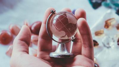 Globe souvenir hand glass 4k wallpaper