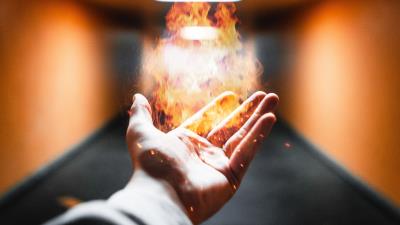 Hand fire flame 4k wallpaper