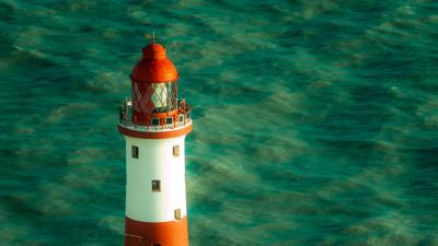 Lighthouse water building 4k wallpaper