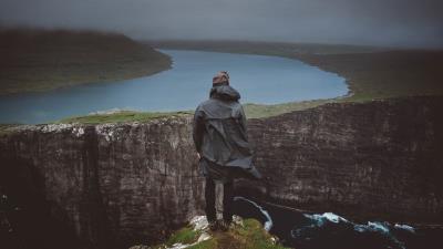 Man cliff river 4k wallpaper