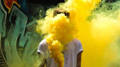 Man colored smoke yellow 4k wallpaper