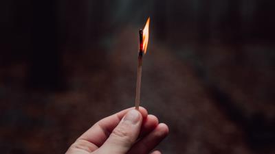 Matchstick hand fire 4k wallpaper