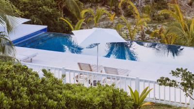 Palm trees pool deck chairs 4k wallpaper