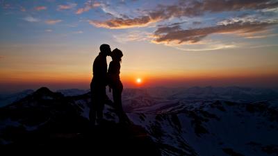 Love couple kissing on mountain top 8k wallpaper
