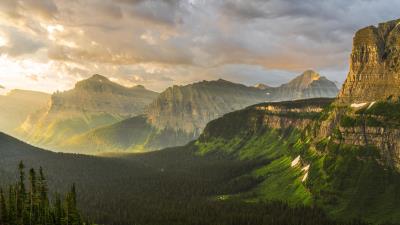 stormy sunrise at glacier national park 4k iy wallpaper