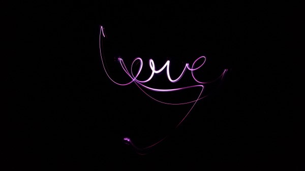Neon Love Inscription wallpaper