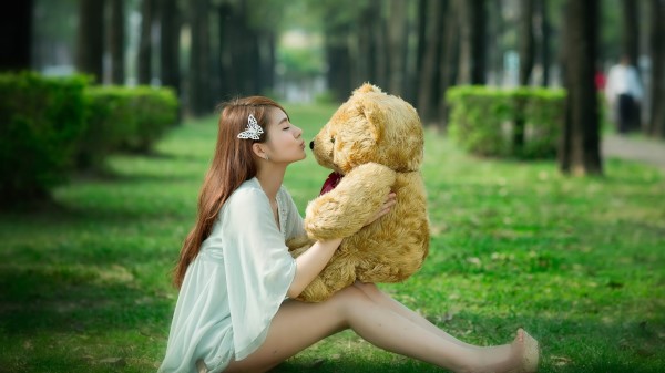 Redhead Playing With A Teddy 8k wallpaper